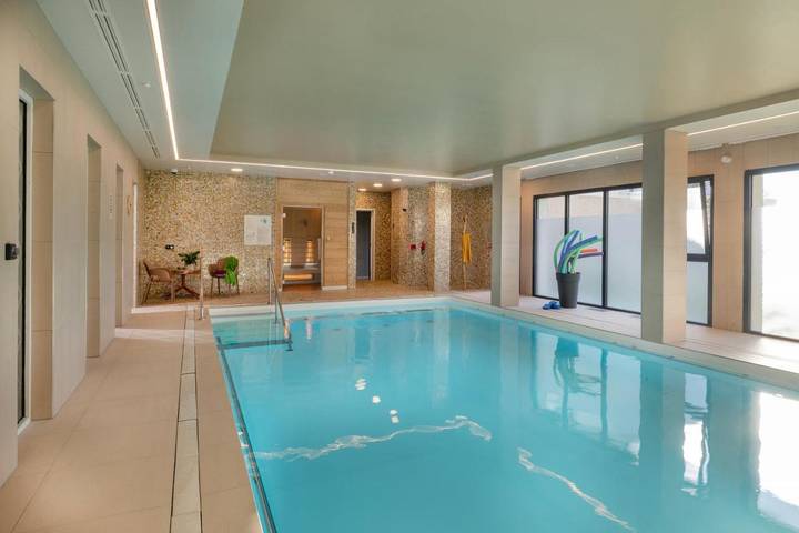 Location de vacances pour 2 personnes, avec piscine et jardin ainsi que sauna et jacuzzi à Téteghem