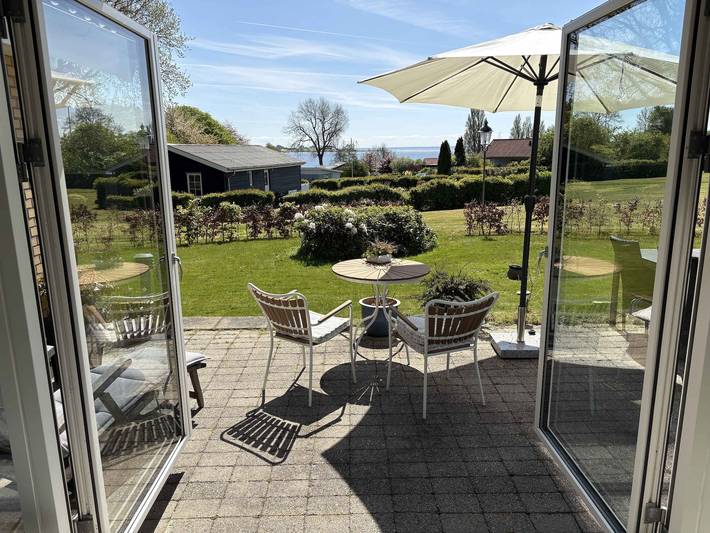 Ferienhaus für 4 Personen, mit Terrasse und Garten sowie Seeblick