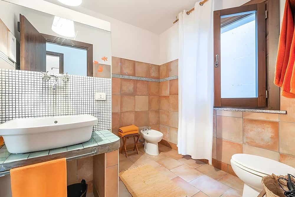 Apartamento entero, Apartamento 'La Luna Sulla Duna' con vistas al mar, terraza privada y aire acondicionado in Playa de Porto Pino, Porto Pino