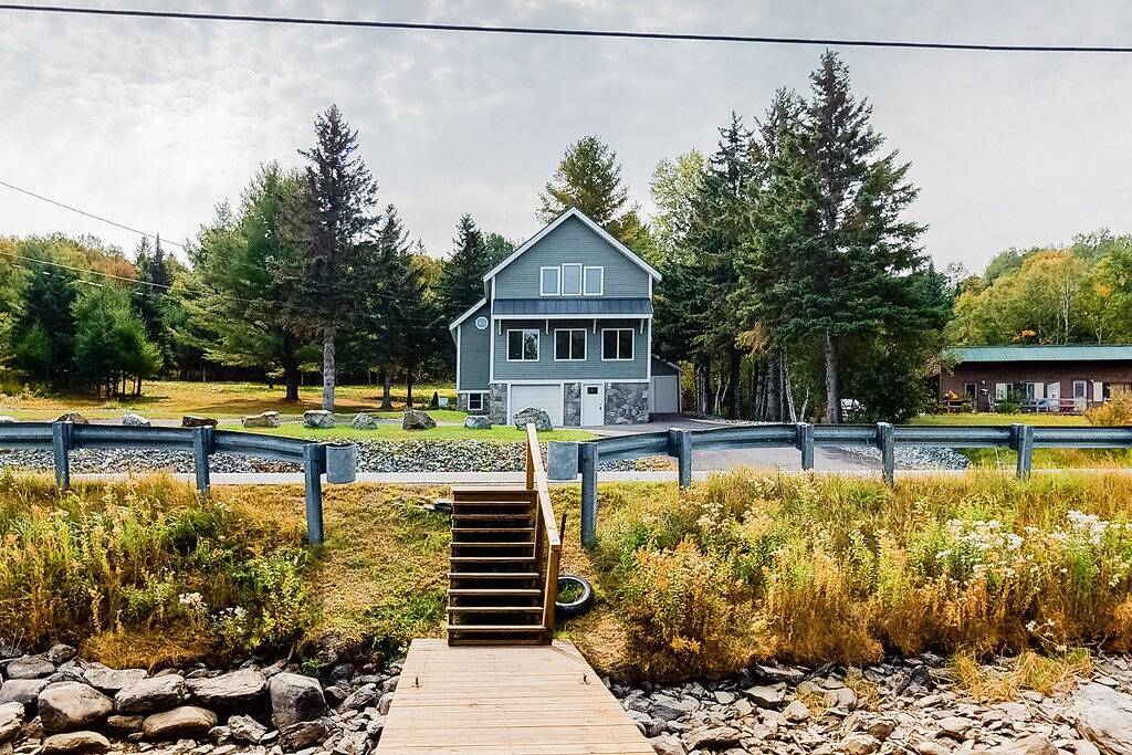 Charming riverfront home with mountain views & private dock in Moosehead Lake