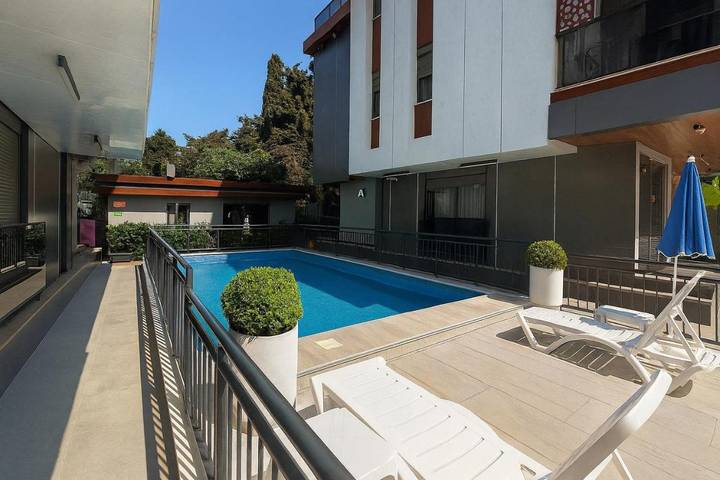 Appartement de vacances pour 4 personnes, avec jardin ainsi que vue et piscine