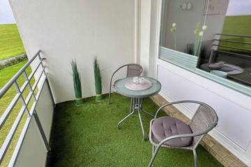 Ferienwohnung für 2 Personen, mit Garten und Balkon in Grimmershörn