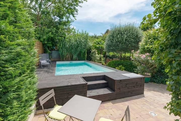 Appartement de vacances pour 4 personnes, avec Terrasse et Jardin ainsi que Piscine et Vue