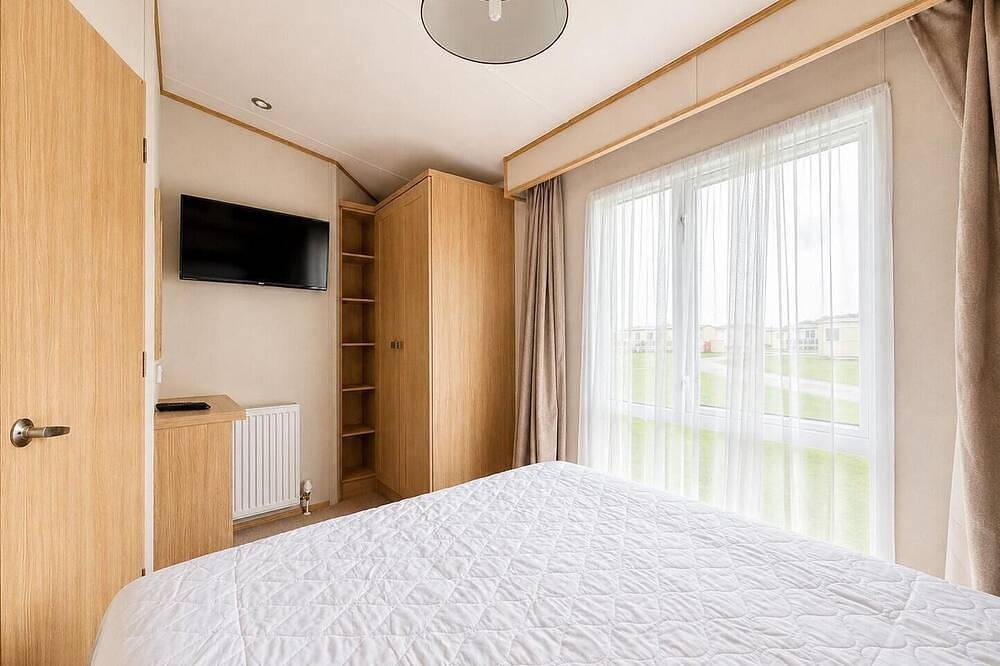 Homely caravan with decking at Golden Sands Haven Holiday Park in Mablethorpe, Lincolnshire