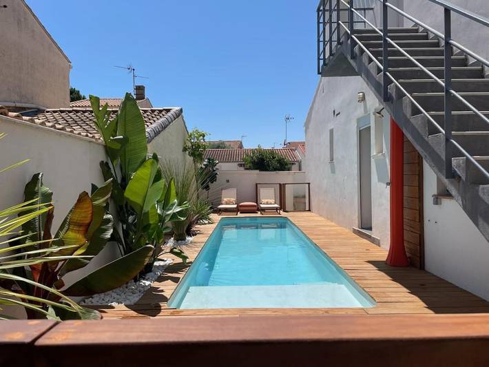 Appartement de vacances pour 4 personnes, avec Terrasse ainsi que Jardin et Piscine