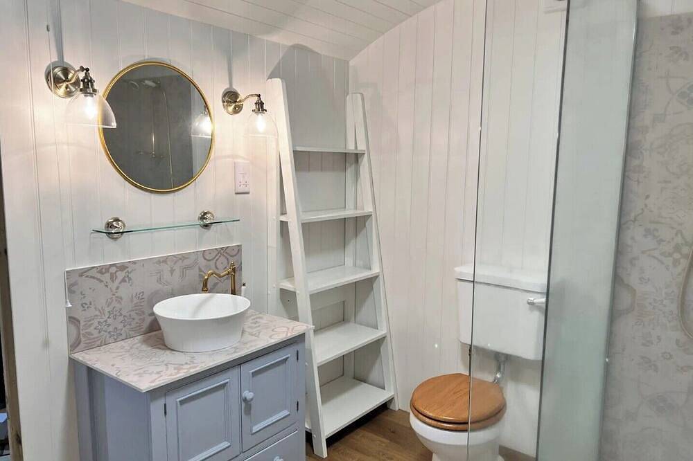 Boutique Shepherds Hut set in a wildflower meadow on a farm with Highland Cows in West Chiltington, South Downs