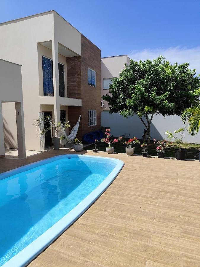 Casas e apartamentos de temporada para 4 pessoas, com balcão e piscina, com animais de estimação em Guriri