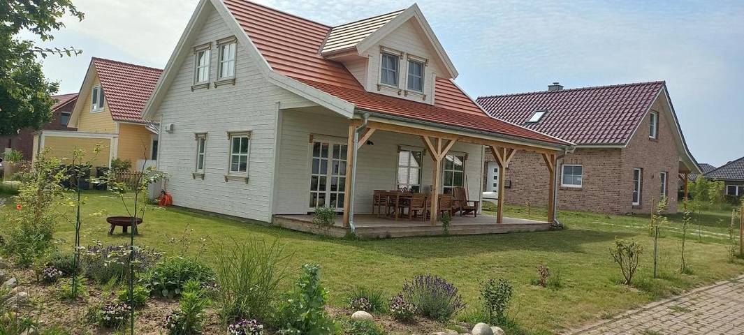 Ferienhaus für 7 Personen, mit Terrasse und Garten sowie Seeblick und Ausblick