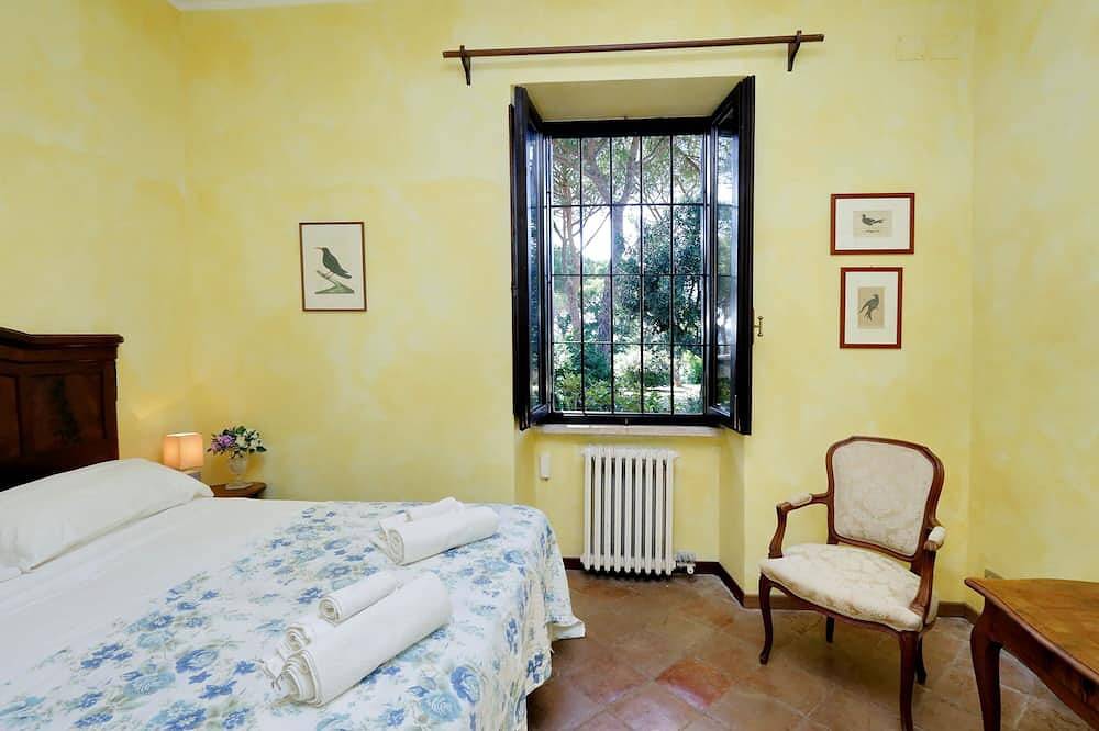 Villa surrounded by greenery in the typical Roman country house in Marcigliana, Rome