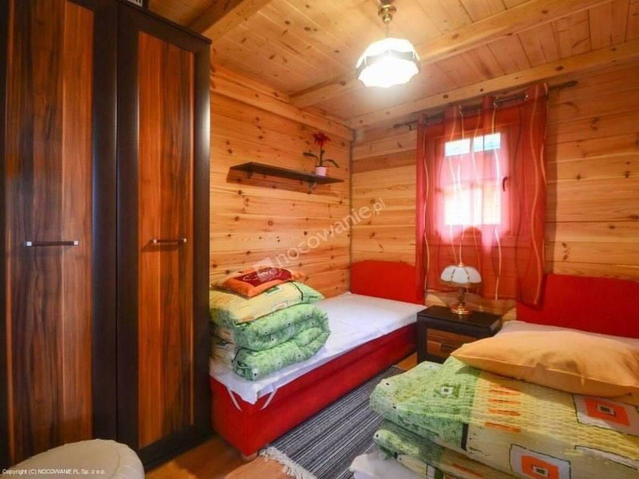 Gemütliches Holzferienhaus mit Grill und Garten in Rusinowo, Powiat Sławieński