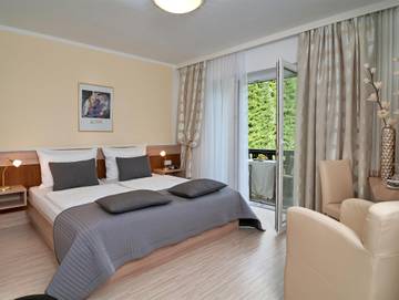 Ferienwohnung für 2 Personen, mit Seeblick und Garten, kinderfreundlich am Faaker See