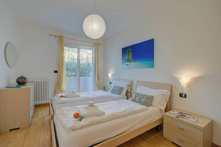 Entire apartment, Agritur Laura - Danza di colori 3 with Shared Garden, Torbole sul Garda, Italy in Torbole, Nago-Torbole