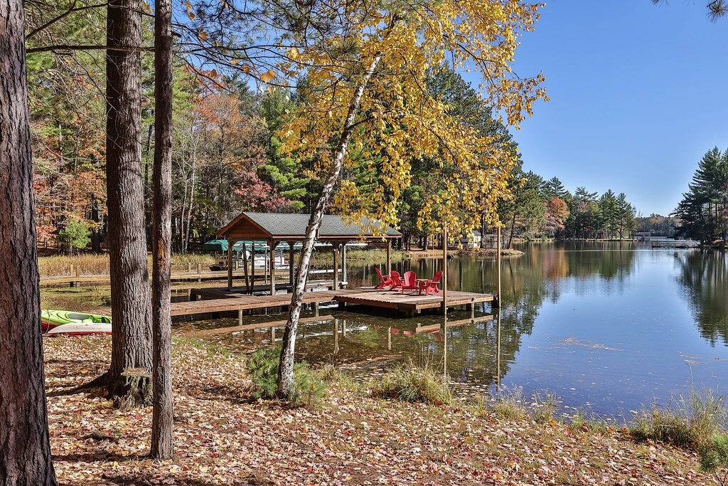 Dog-friendly, lakefront lodge in the woods with large dock, central Ac, & canoe in Vilas County