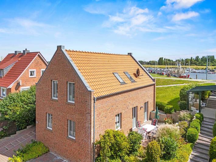 Ferienhaus für 6 Personen, mit Garten und Terrasse sowie Seeblick, kinderfreundlich in Krummhörn