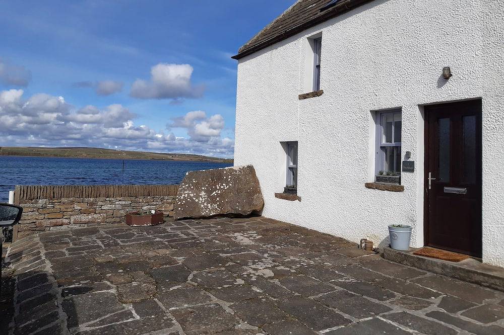 Einzigartiges Ferienhaus am Meer in einem malerischen Dorf. in Orkney Inseln
