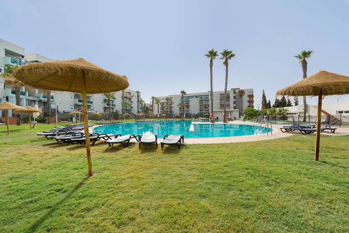 Entire apartment, Premium family apartment in Almerimar with garden and pool views in Almerimar, El Ejido