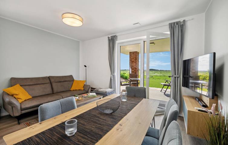 Ganze Ferienwohnung, Modernes Apartment mit Terrasse, Parkplatz und TV - 500m nach Ovelgönne in Ovelgönne, Wesermarsch