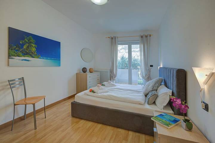 Entire apartment, Agritur Laura - Danza di colori 3 with Shared Garden, Torbole sul Garda, Italy in Torbole, Nago-Torbole