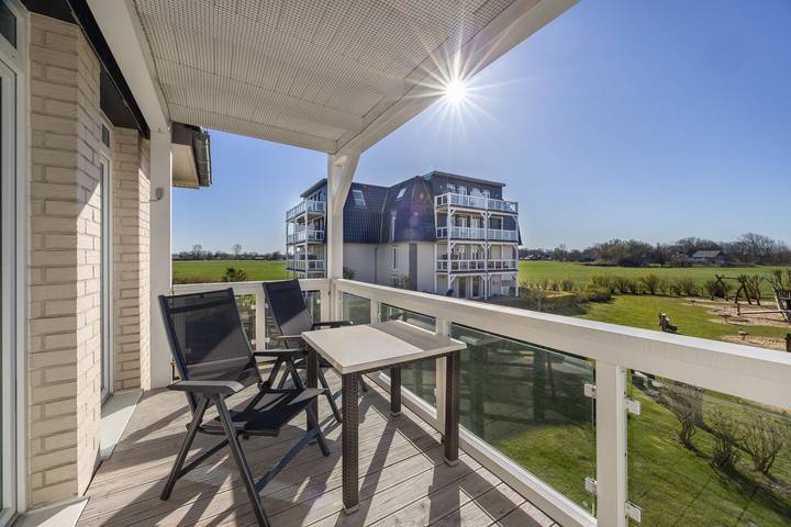 Ferienwohnung für 4 Personen, mit Sauna und Ausblick sowie Balkon in Wremen