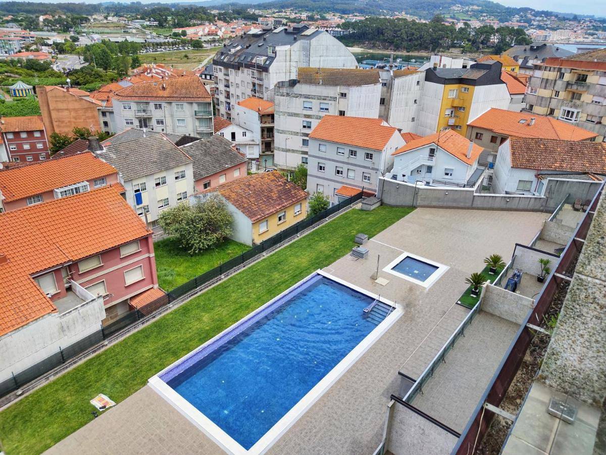 Apartamento entero, Desconectaengalicia Ático La Perla, piscina y pista tenis in Praia de Caneliñas (Sanxenxo), Sanxenxo