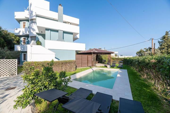 Ferienhaus für 7 Personen, mit Garten und Ausblick sowie Pool in Koskinou