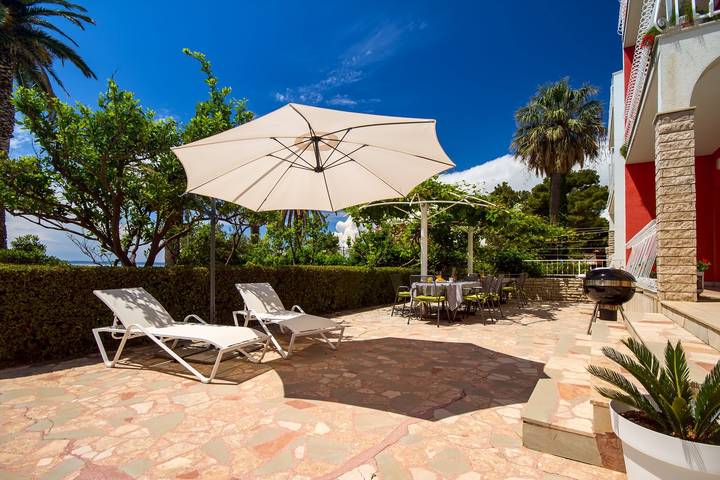 Beachfront Bliss: Villa Amor with a heated pool in Podstrana, Split-Dalmatia