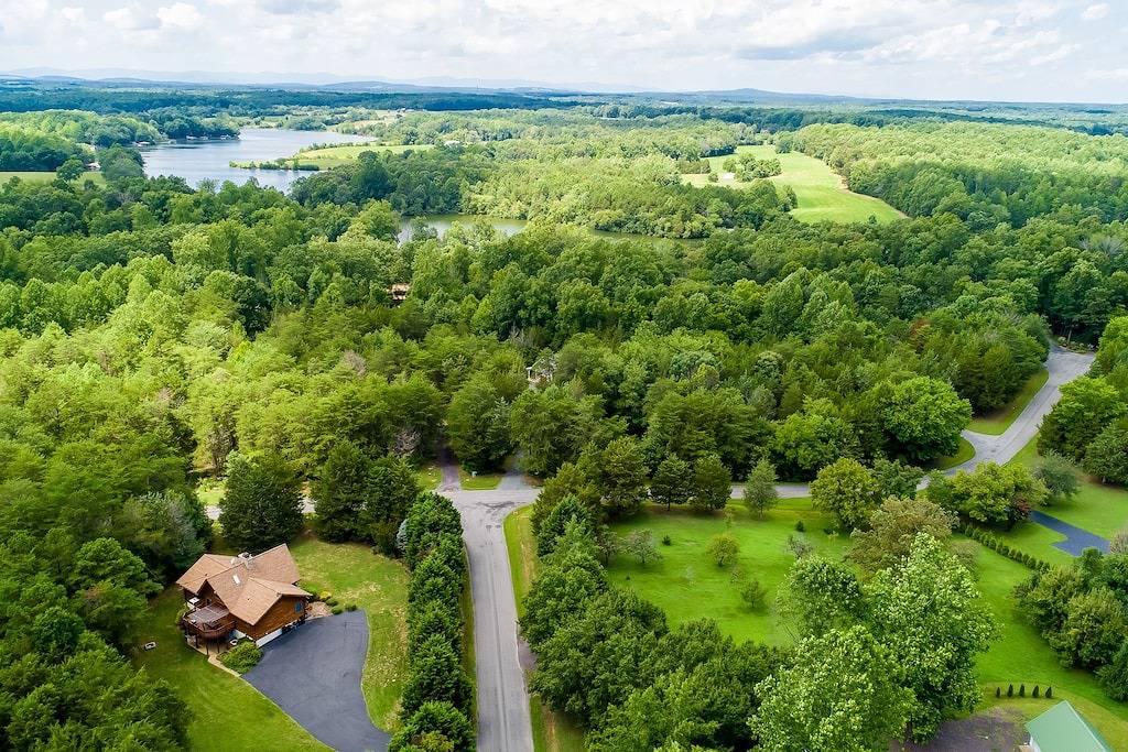 Three-story dog-friendly home with large deck, wood swing, firepit, lawn, & more in Lake Anna