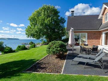 Ferienhaus für 8 Personen, mit Garten und Sauna sowie Terrasse und Ausblick, mit Haustier in Middelhagen