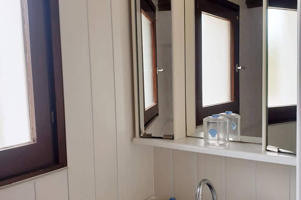 A blue house on the wild coast in Batz-sur-Mer, Côte d'Amour