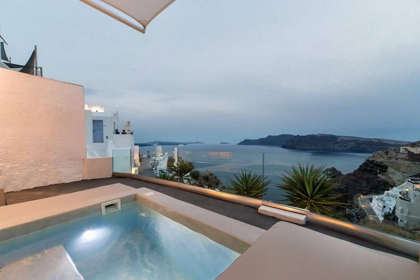 Charming Santorini Suite | Yagos Suite | 1 Bedroom | Min. Children Age: 12 Years | Private Furnished Balcony with Hot Tub Overlooking the Sea | Spacious Shared Sun Terrace and Swimming Pool with Breathtaking Caldera View | Oia in Oia, Santorin