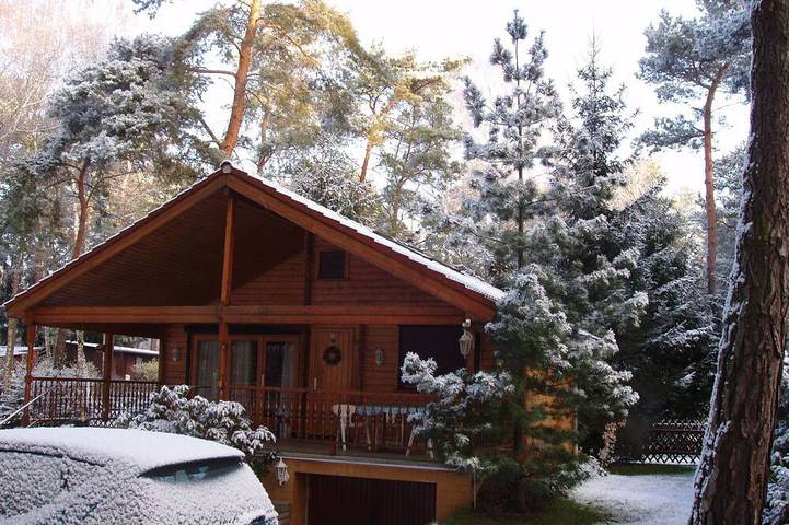 Idyllic wooden dacha with jetty and rowing boat just outside Berlin in Prieros, Heidesee