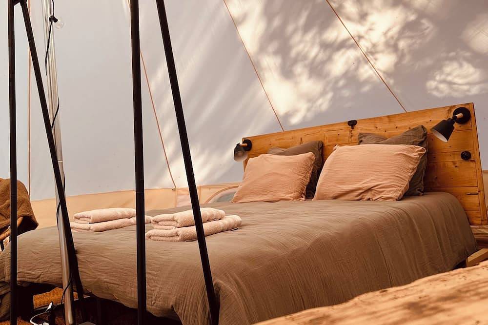 A Comfortable Nature Getaway at Moulin de Saza: Glamping Tent with a Pool in Le Vigeant, Vienne
