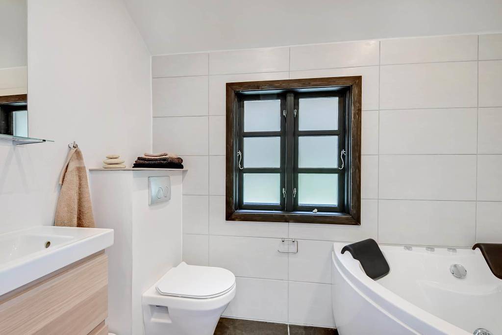 Modernised holiday home with woodburning stove, whirlpool and great wooden terrace in Vester Husby, Husby