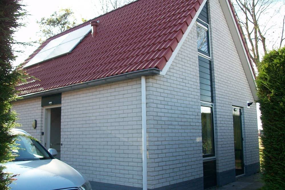 Freistehender Bungalow auf 450 m2 Grundstück, eingezäunter Garten mit freiem Blick in Zeeuwse Kust