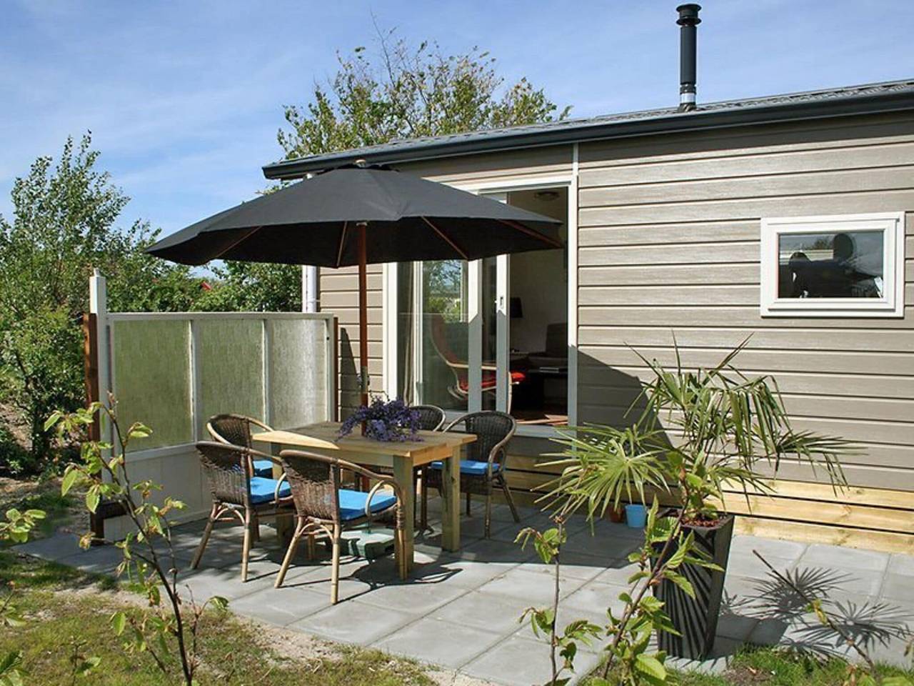 Mooi chalet tussen golfbaan en strand in Hollum, Nederlandse waddeneilanden