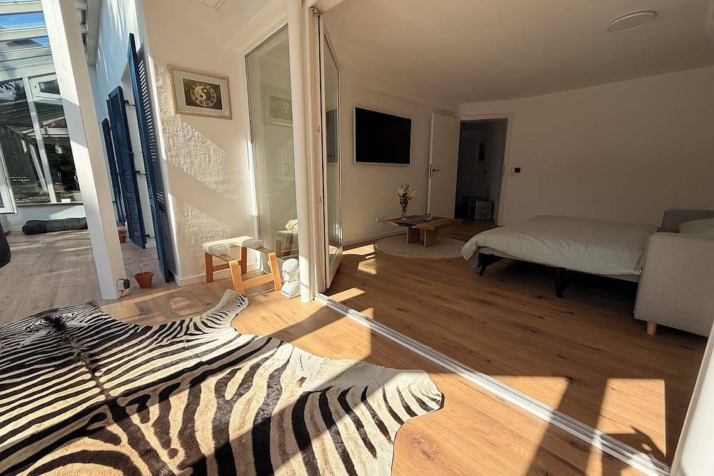 Entire apartment, A Retreat on Lake Ammersee, 2-room apartment, 87 square meters, 5 minutes to the lake, relaxing garden, pet-friendly in Utting am Ammersee, Ammersee