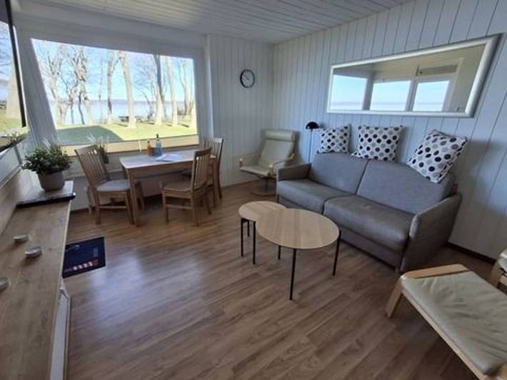 Ferienwohnung für 4 Personen, mit Balkon und Garten sowie Seeblick und Ausblick