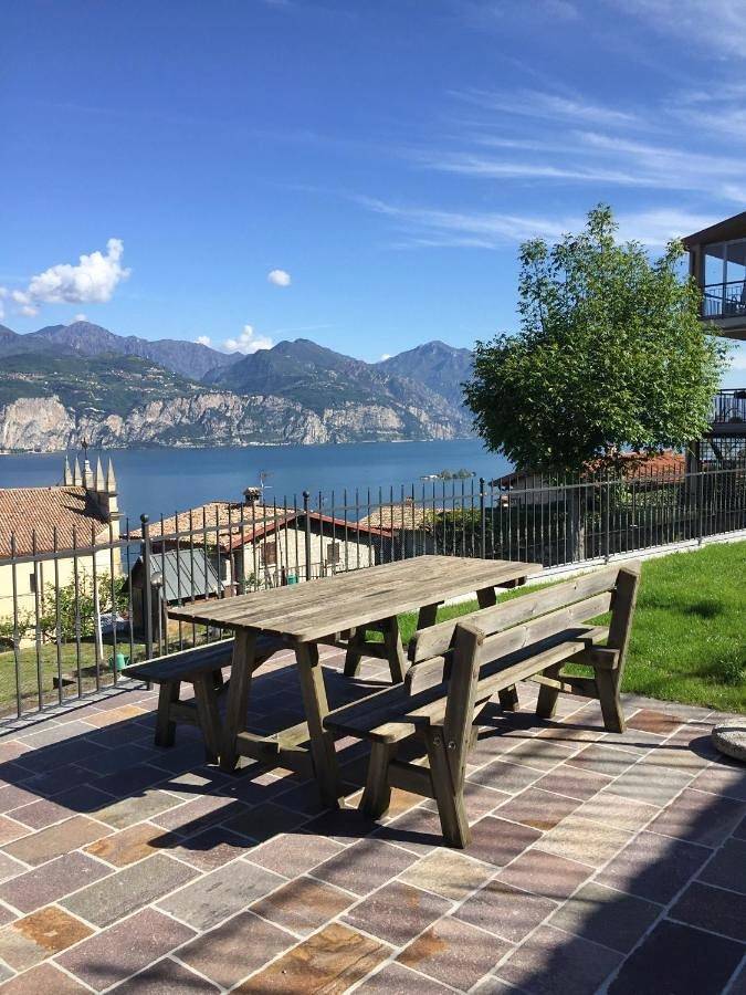 Appartamento per 2 persone, con giardino e panorama nonché vista lago in Brenzone