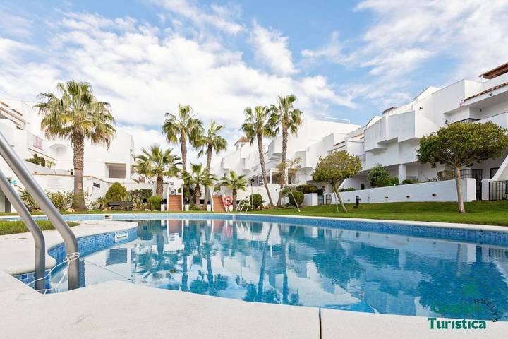 Apartamento de férias para 4 pessoas, com piscina e jardim em Isla Cristina