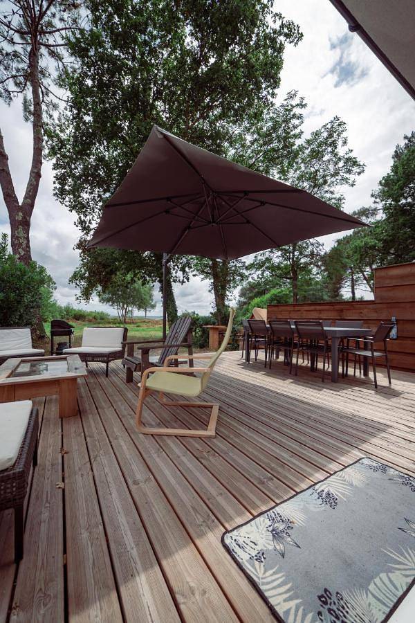 Location de vacances pour 8 personnes, avec vue sur le lac ainsi que jardin et vue dans Plage Moutchic