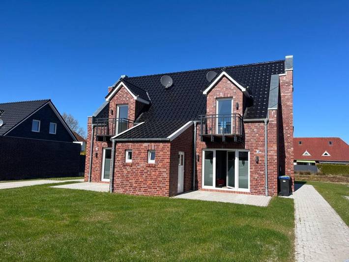 Ferienhaus für 5 Personen, mit Balkon und Terrasse sowie Garten und Seeblick in Großefehn