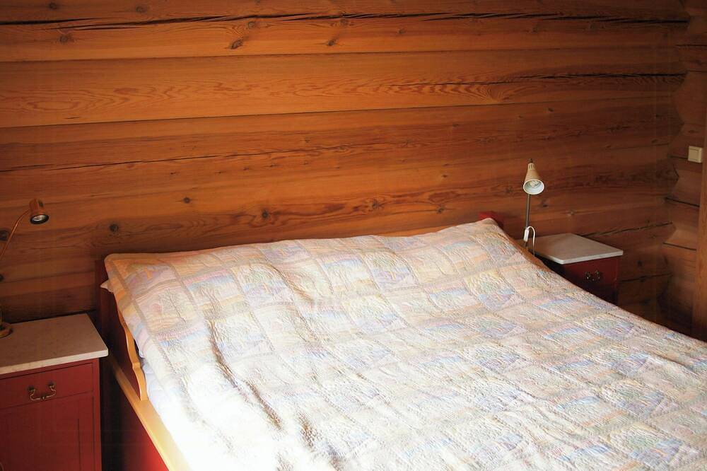 Cabin with wooden interior by Lake Tinnsjøen in Tinn