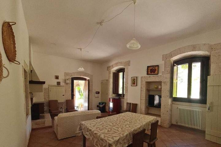 Stone farmhouse surrounded by greenery with shared pool in Putignano, Region de Bari