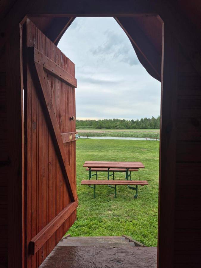 Szałasy drewniane nad rzeką Biebrza in Goniądz, Podlasie