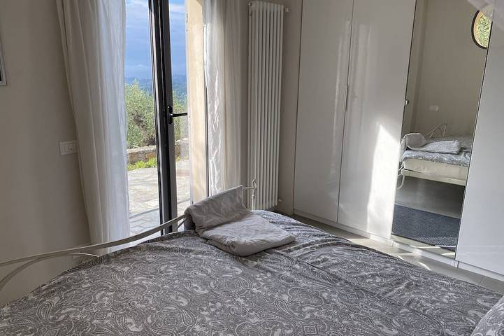 Modern architect's house in olive grove with sea views in Vasia, Riviera di Ponente