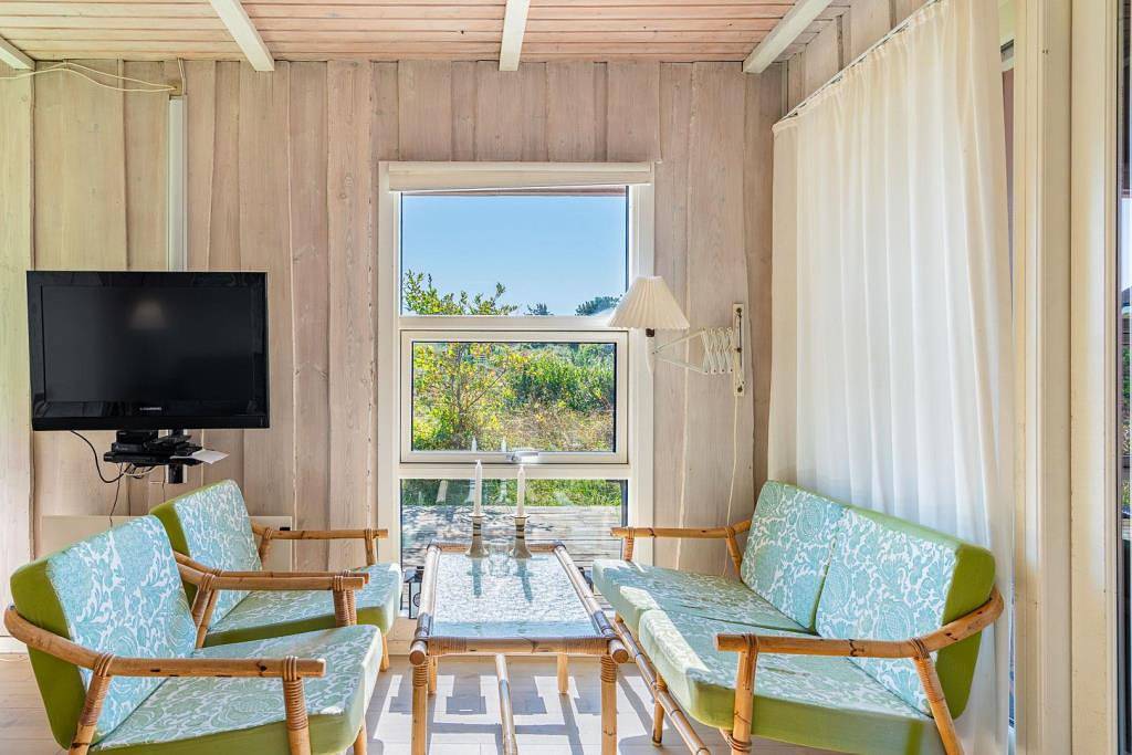 Ferienhaus auf einem schönen, hügeligen Naturgrundstück. in Henne, Varde