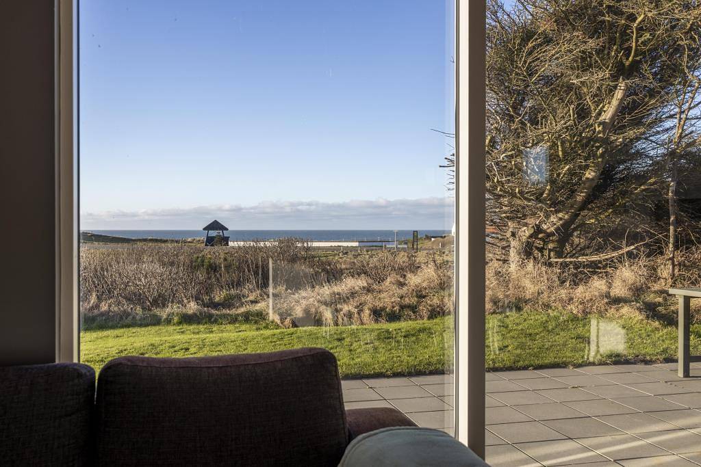 Wunderschönes und einladendes Ferienhaus mit herrlichem Meer- und Seeblick in Nr. Lyngby, Hjørring und Umgebung