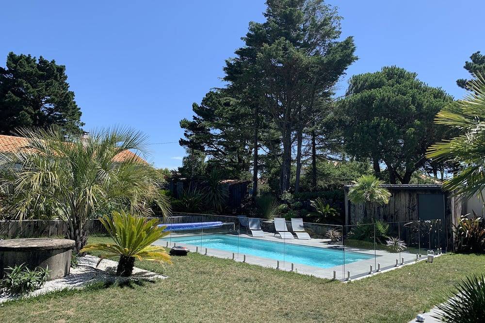 Maison familiale proche mer - piscine chauffée filet trampoline jardin exotique. in Les Moutiers-en-Retz, Côte de Jade