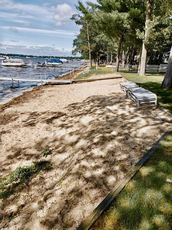 New Listing! Lake front cottage with 100' of private sandy beach in Prudenville, Roscommon County