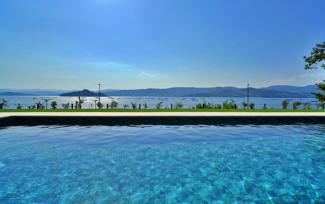 Galihost - Rd Hotel Apartamento con piscina climatizada in Praia de Laño (Poio), Poyo